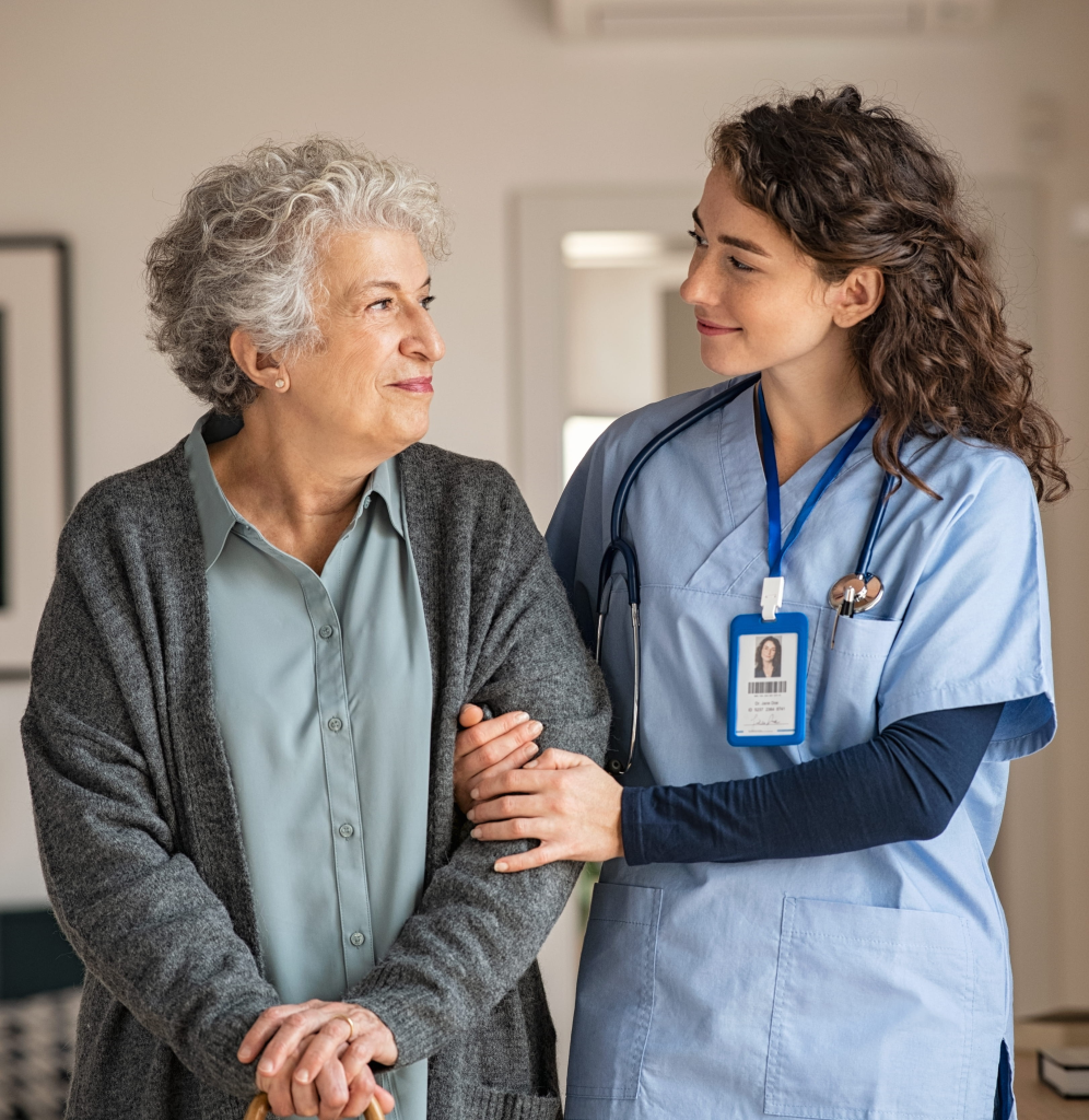 Health care worker helping an elderly patient